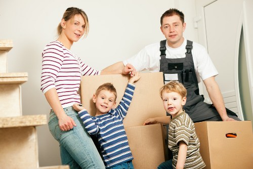 Local moving team loading furniture for removals in Oldoakcommon