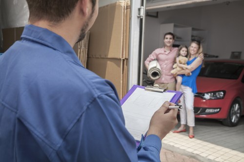 Professional local removals in Oldoakcommon with moving van and packed boxes