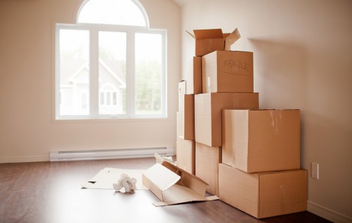 Packed moving boxes organized for a flat removals service in Oldoakcommon