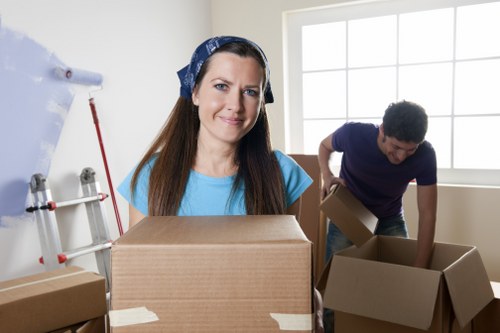 Storage facility staff sorting recyclable cardboard and packaging materials